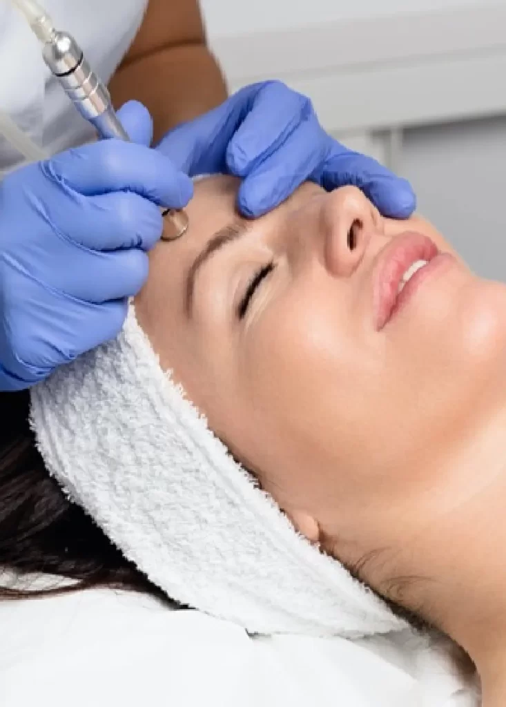 Woman receiving advanced facial skin treatment with a dermatology device