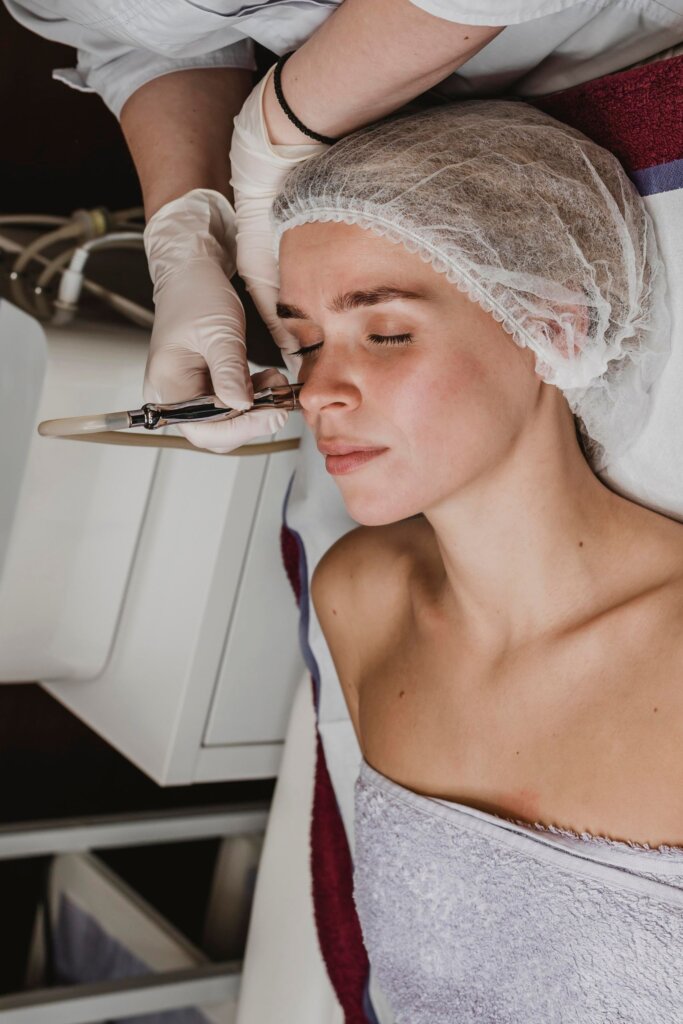 Dermatologist performing pigmentation treatment procedure on face at Emara Skin Clinic